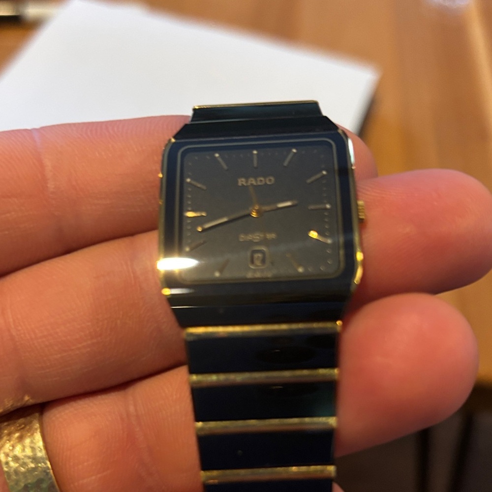 Rado Luxurious Black and Gold Timepiece